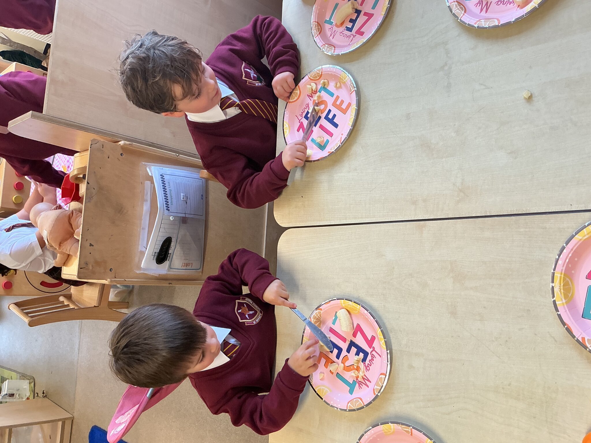 Image of Reception preparing snacks together in RE.
