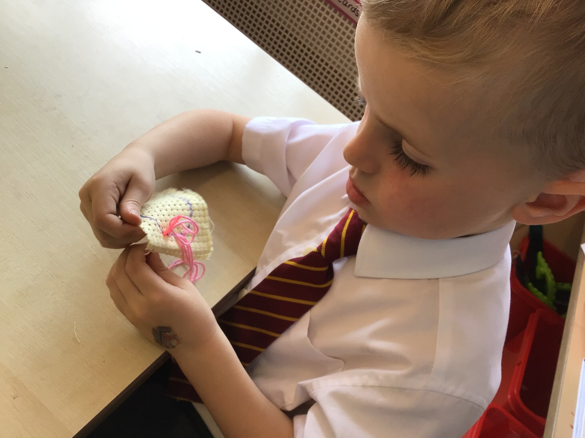 Image of Sewing and threading in Reception