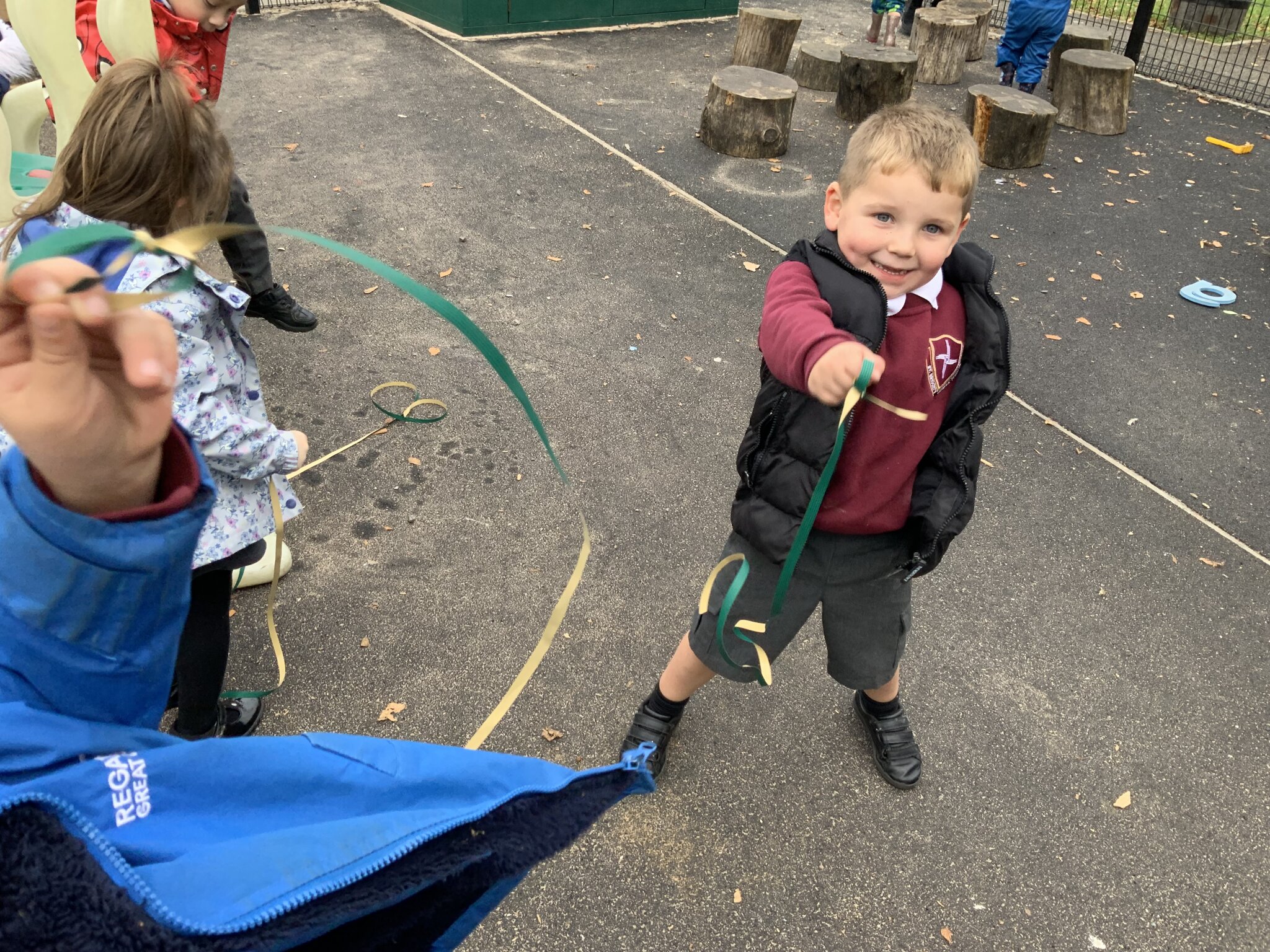 Image of Playing with and making resources outside in Nursery