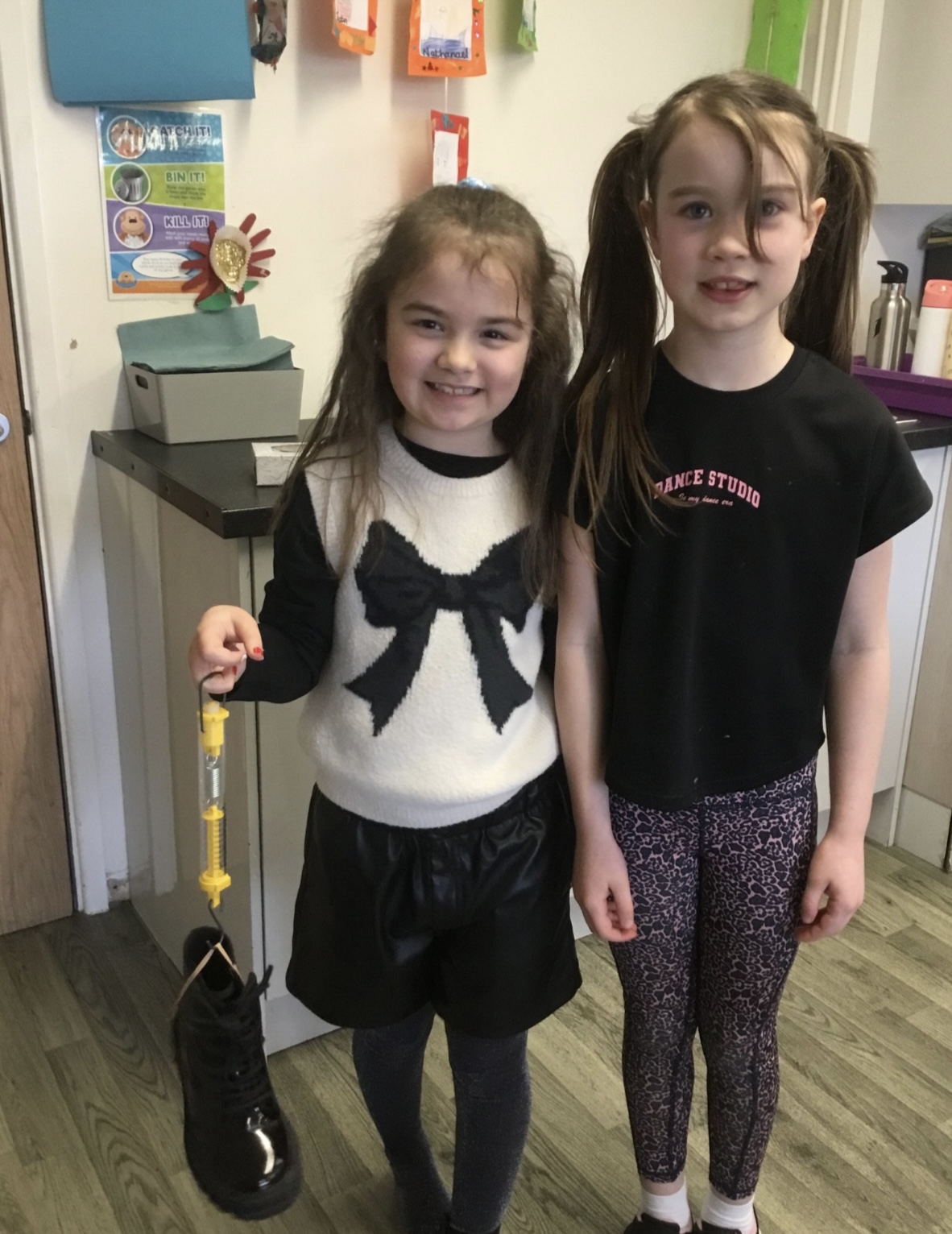 Image of Year 3 use Force meters to measure in Newtons