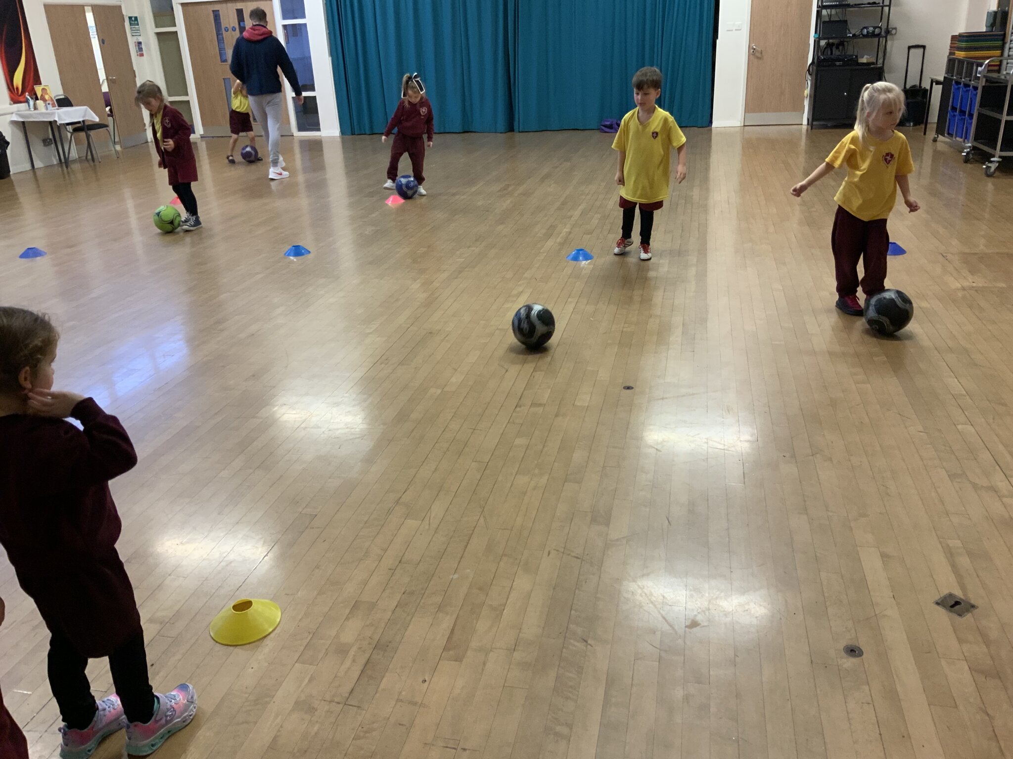 Image of Football coach in Reception