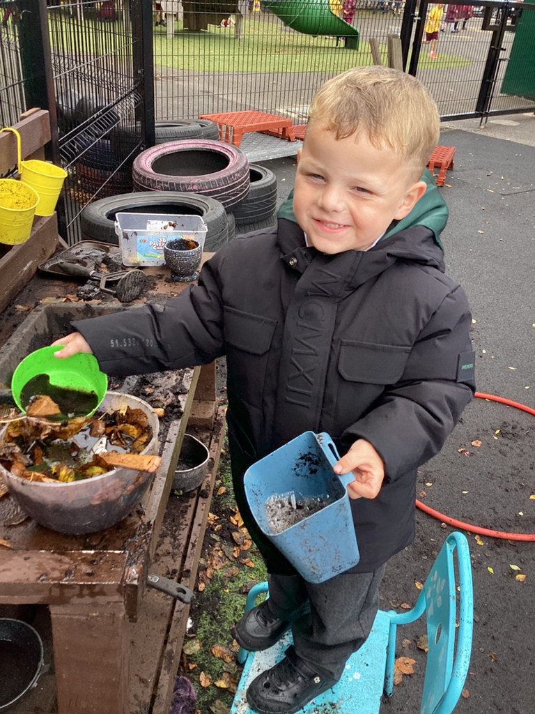 Image of Messy outside play in Nursery