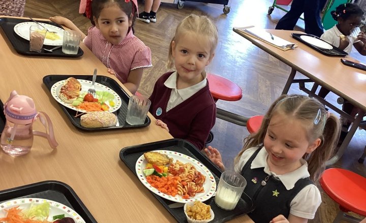Excited new Reception starters during their special school lunch