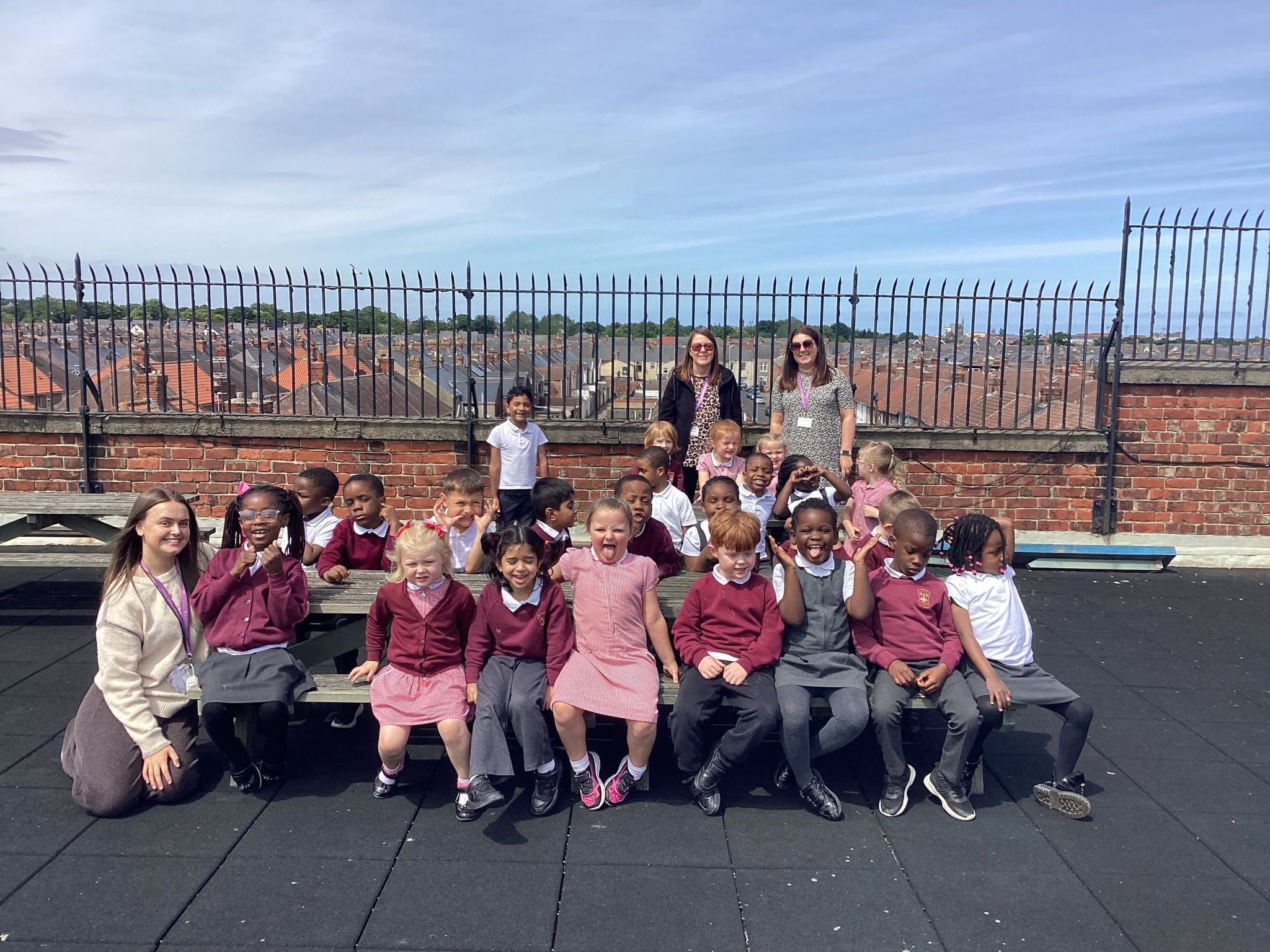 Pupils and Teachers from St Cuthbert's Hartlepool sat on their roof garden