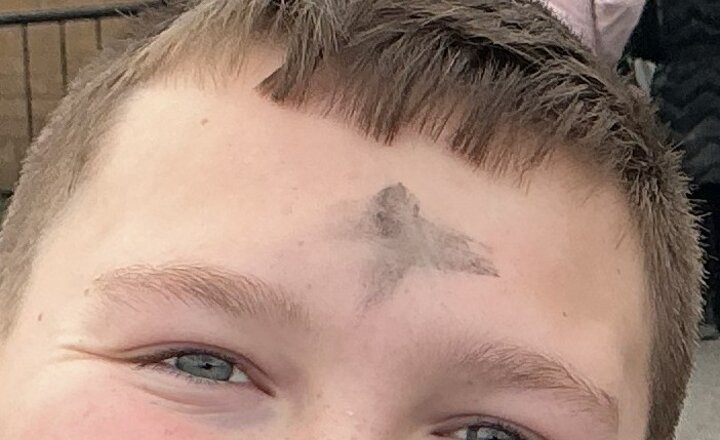 Pupil with the cross marked on their head to celebrate Ash Wednesday
