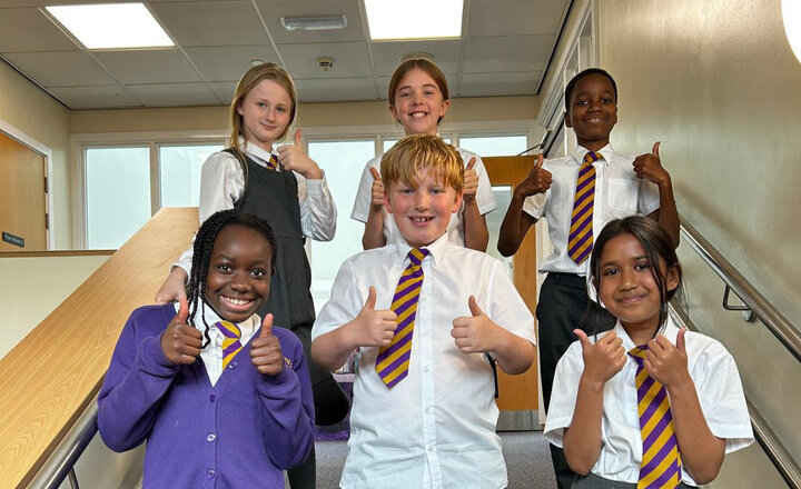 Year 6 pupils with there thumbs up and smiling