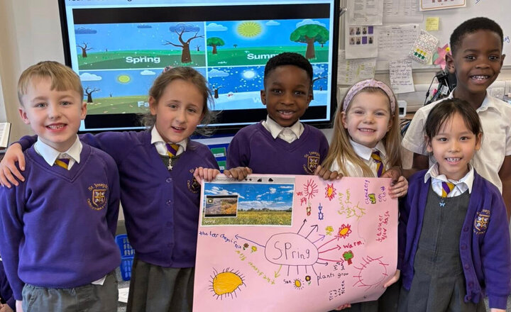 Five St joseph's pupils holding a poster they drew for Spring.