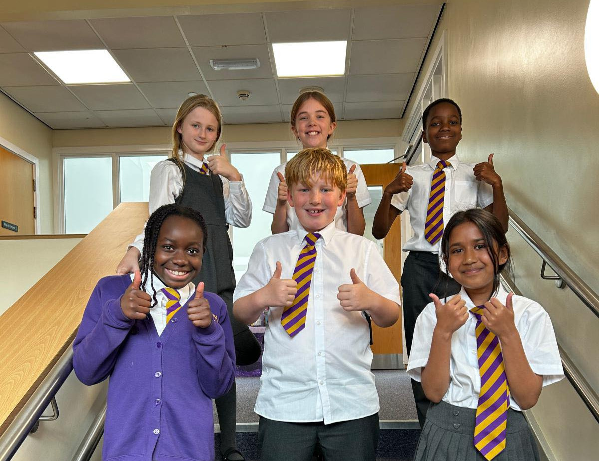 Year 6 pupils with there thumbs up and smiling