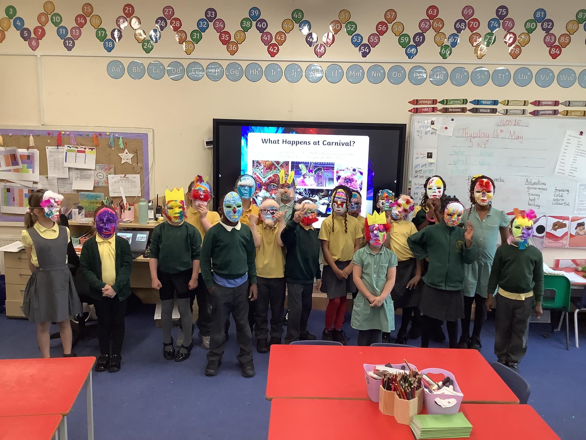 St Joseph's pupils wearing their excellent home made carnival masks!