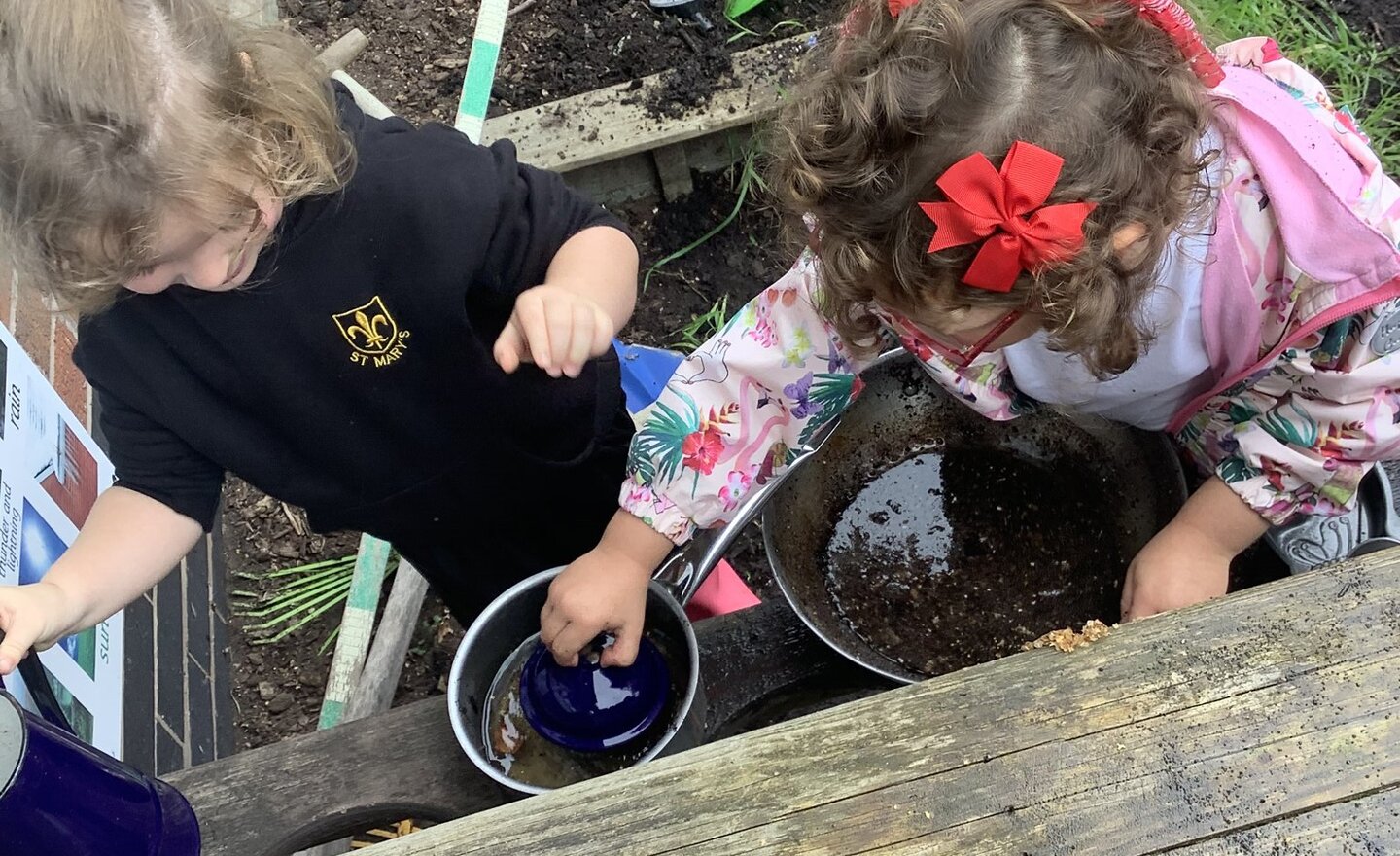 Image of Creativity in the mud kitchen! 
