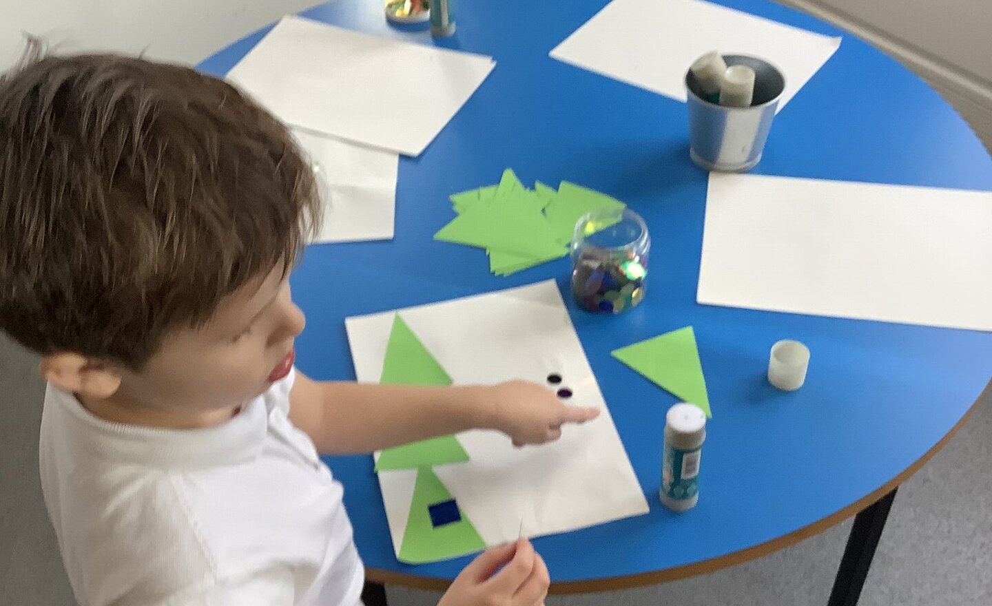 Image of Fun creating Christmas trees using triangles and shapes!