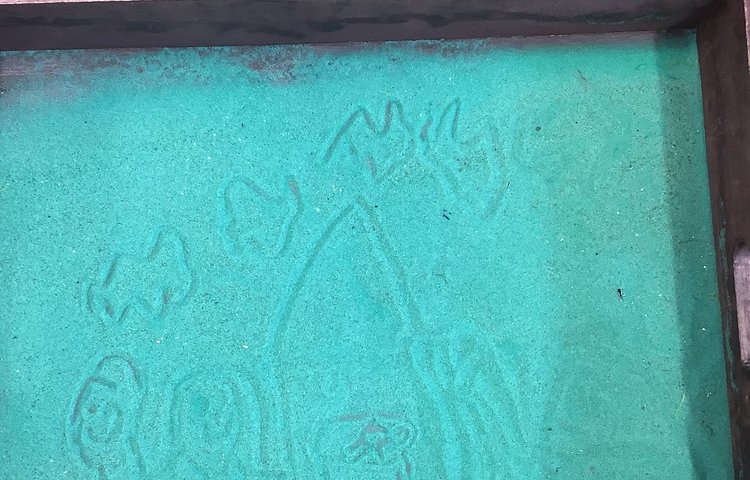 Image of Drawing the nativity scene in the sand!