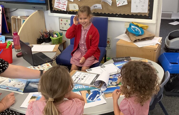 Image of Practicing our oracy skills in the travel agents! 