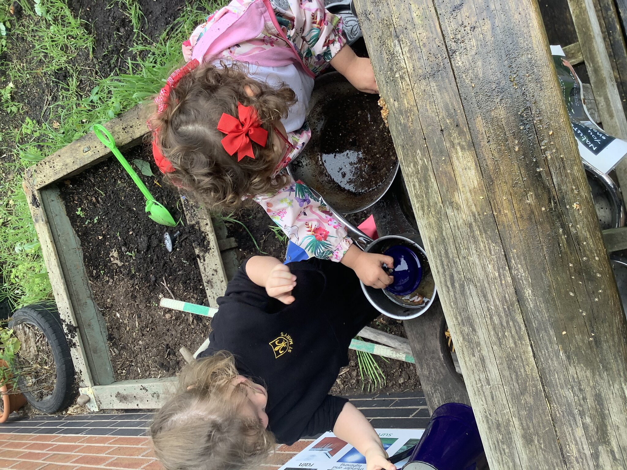 Image of Creativity in the mud kitchen! 