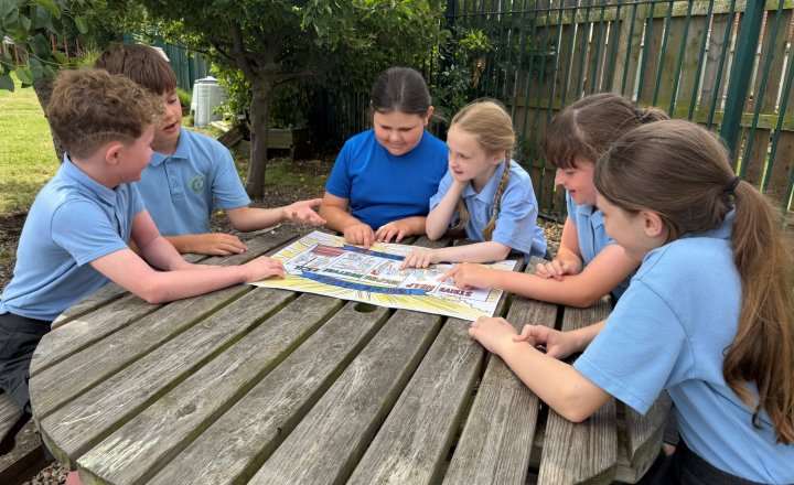 Pupils discussing the SHINE values poster