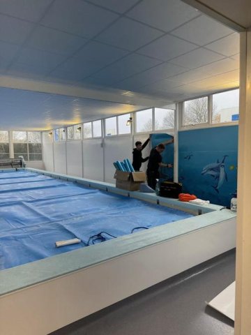 Mrs Watson's mural going back on the wall