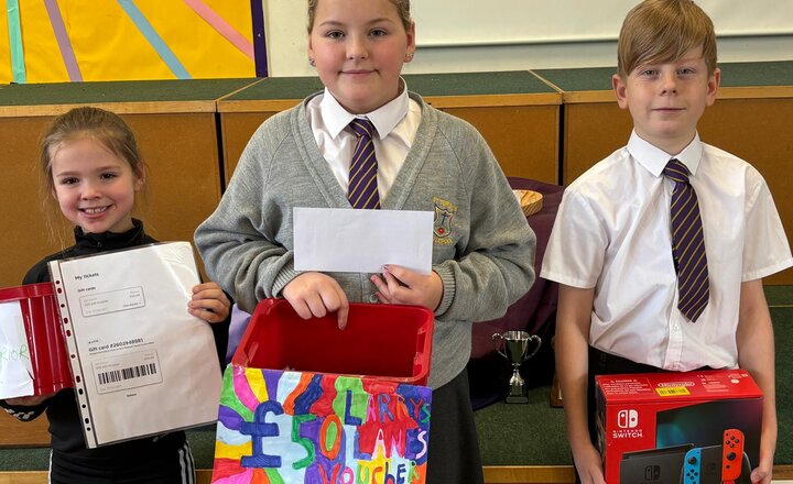 Pupils showing their winnings from the Virtue raffle draw!