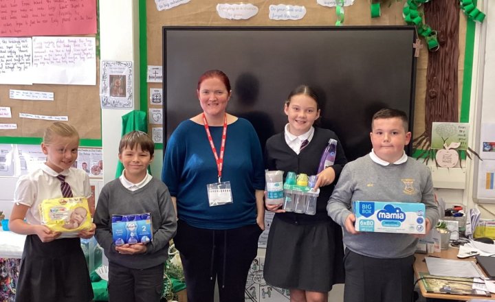 St Teresa's pupils meet Emily from Hartlepool Bank Bank, to learn about the support they provide to the local community