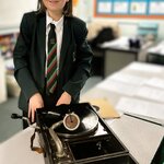 Image of Y8 student, Leo brings his 100 year-old grammar phone into his history lesson