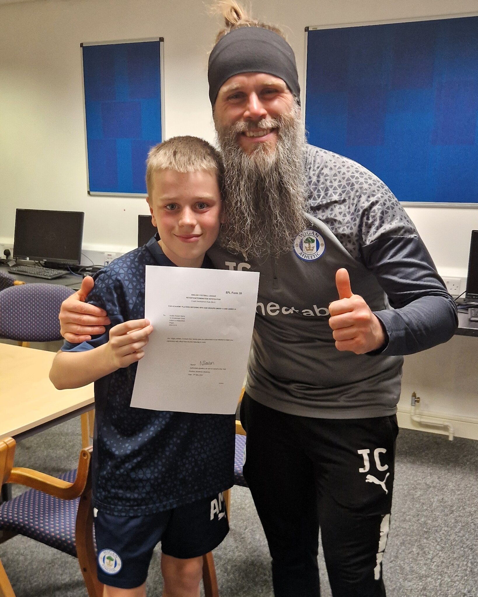 Image of Y7 student signs a 2 year  contract for Wigan Athletic