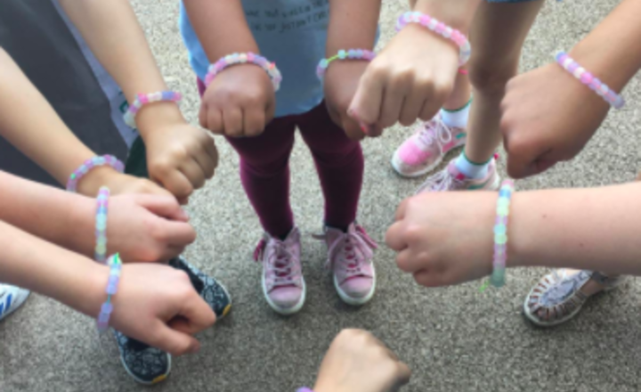 Image of Staff loved making glow in the dark bracelets today with the key worker children!