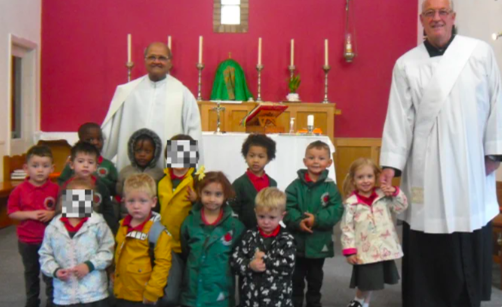 Image of A special blessing by Father Amal and Deacon Kevin.