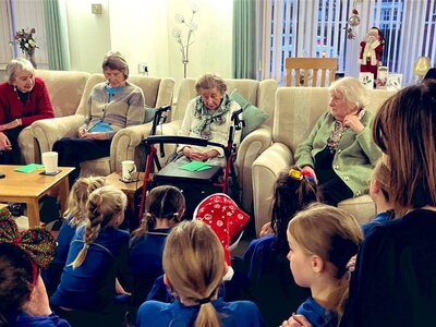 Image of Christmas Carol singing and a very special birthday!