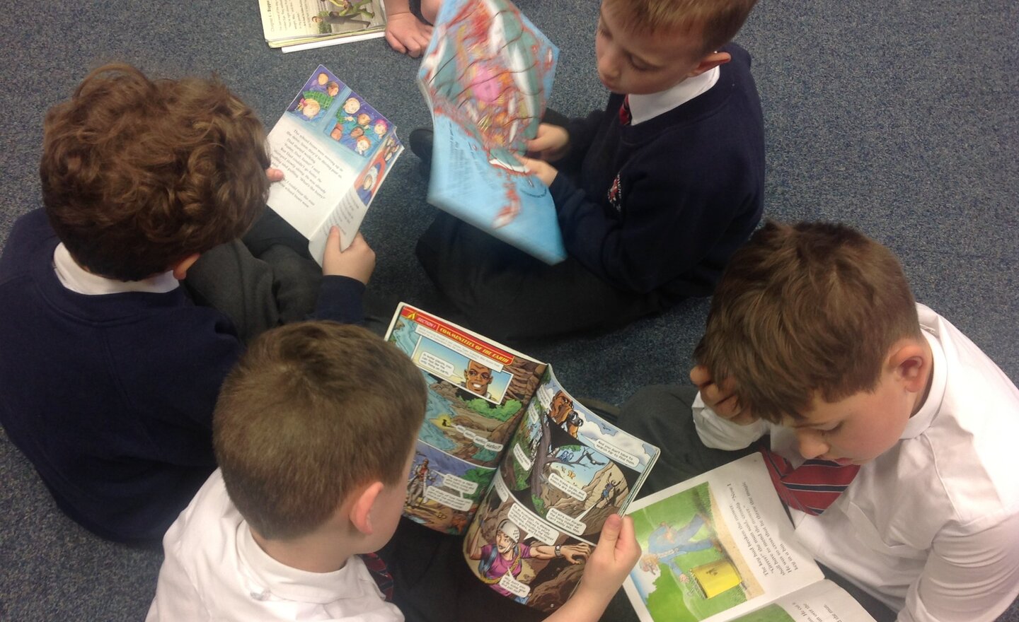 Image of Boys plus books equals an awesome sight!