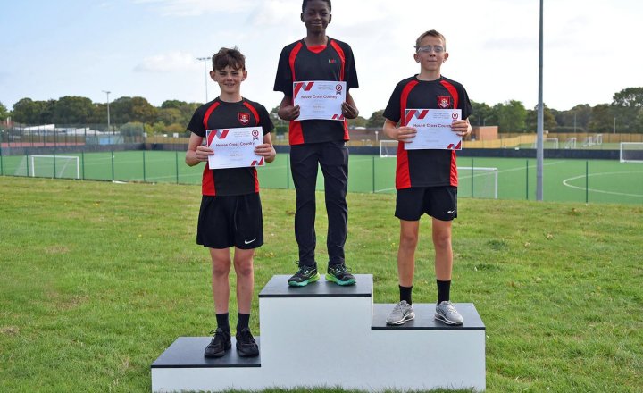 Winning students on the podium after their House Cross Country event