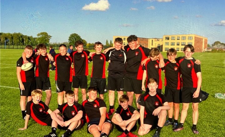 The Year 9 rugby team standing together after their amazing tournament performance