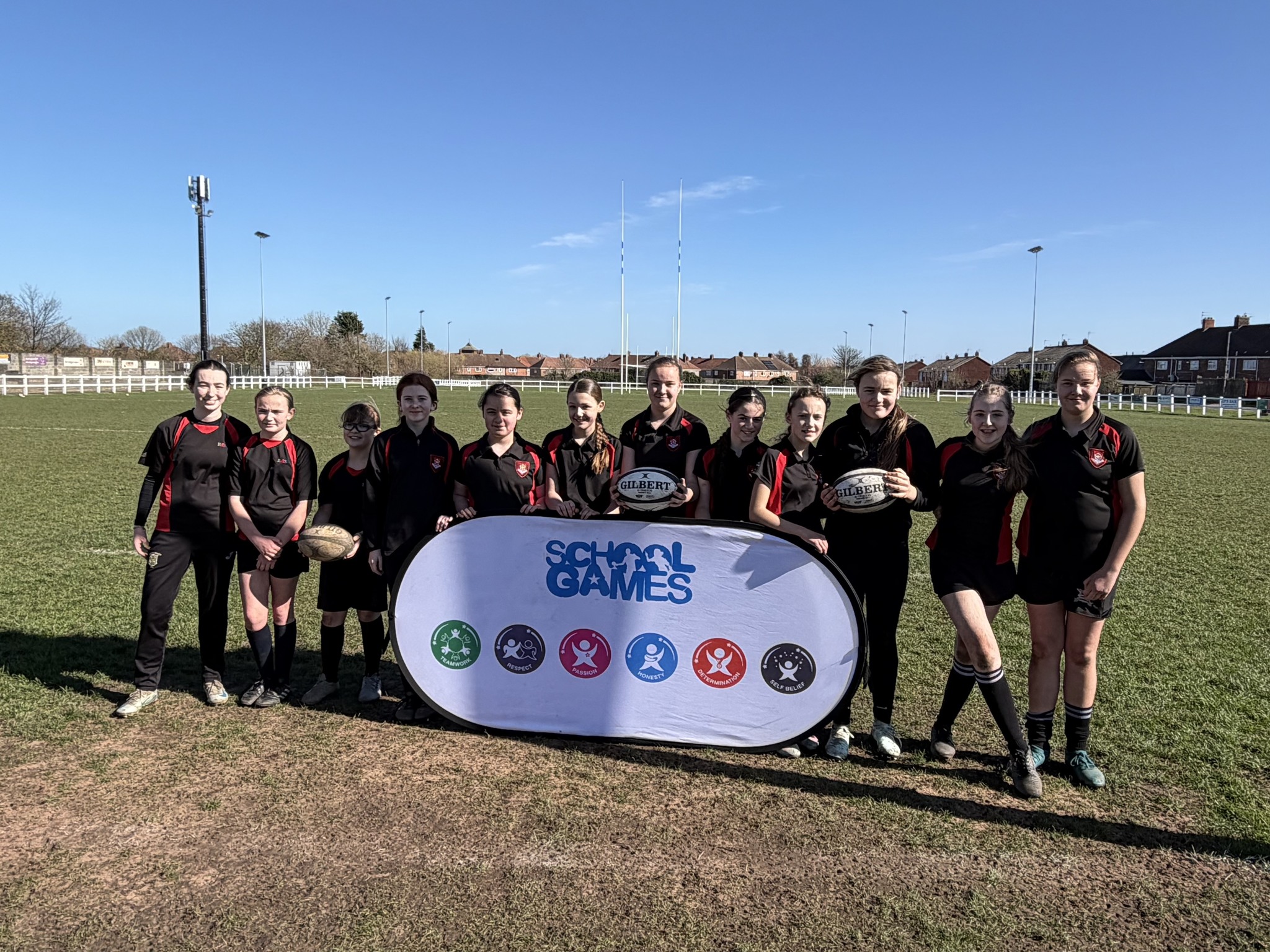 EMS Year 7 Girls celebrating being T1 Rugby Town Champions