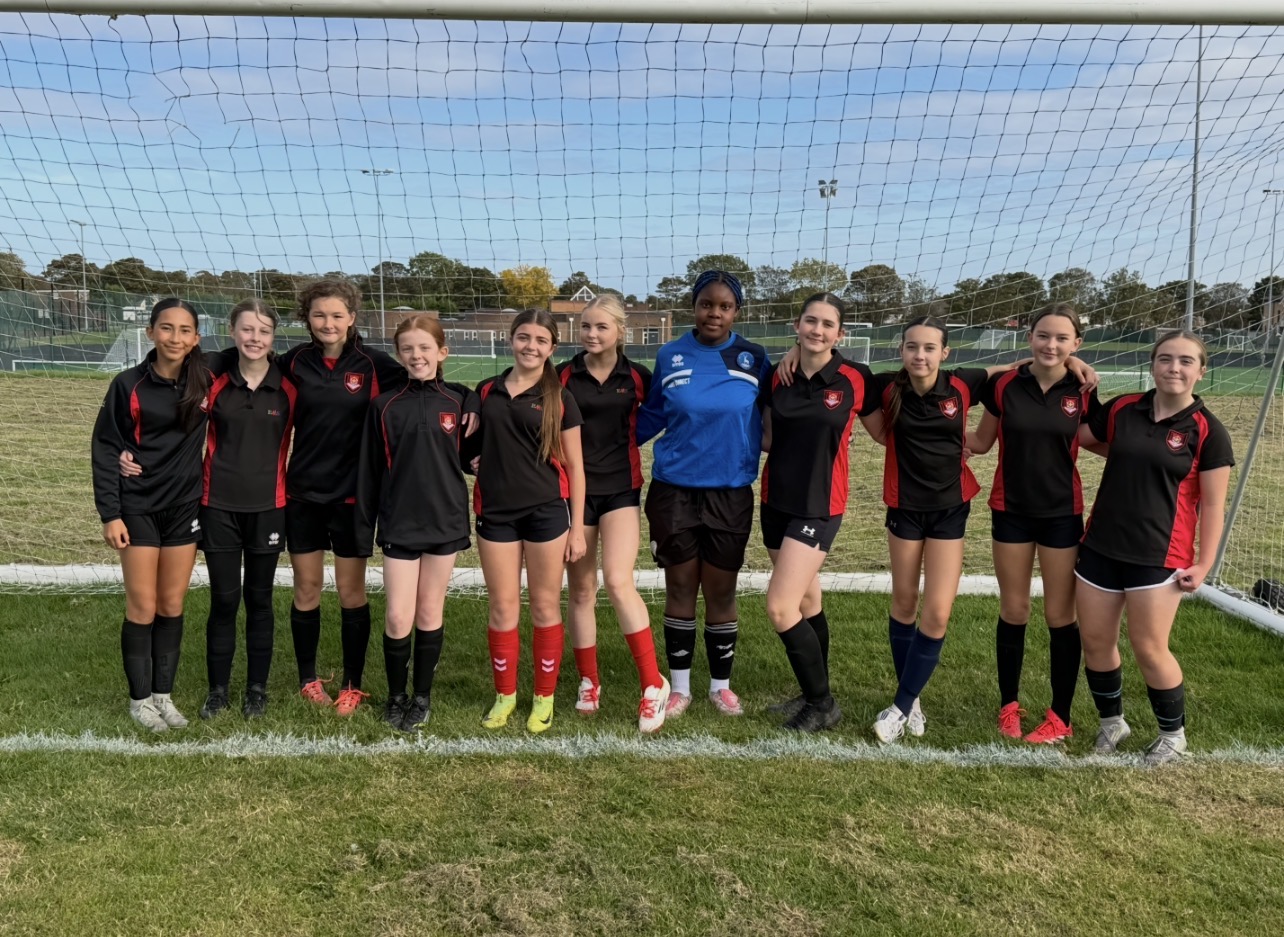 EMS girls football team at the Durham County Plate Football game