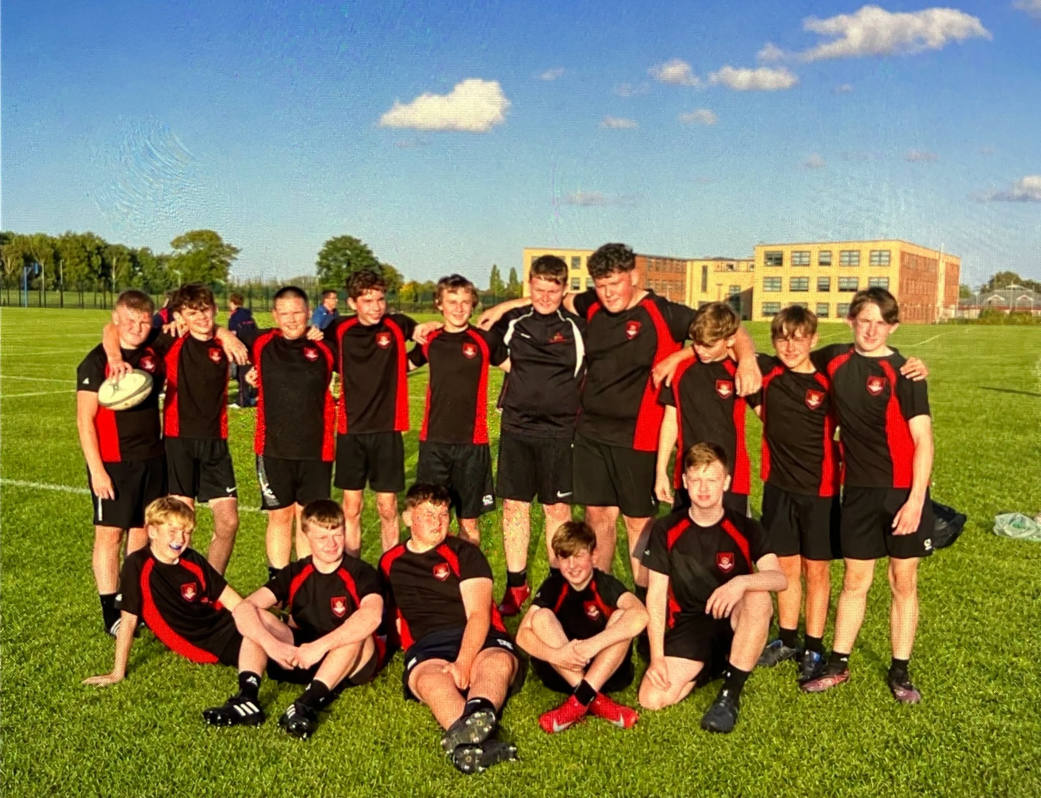 The Year 9 rugby team standing together after their amazing tournament performance