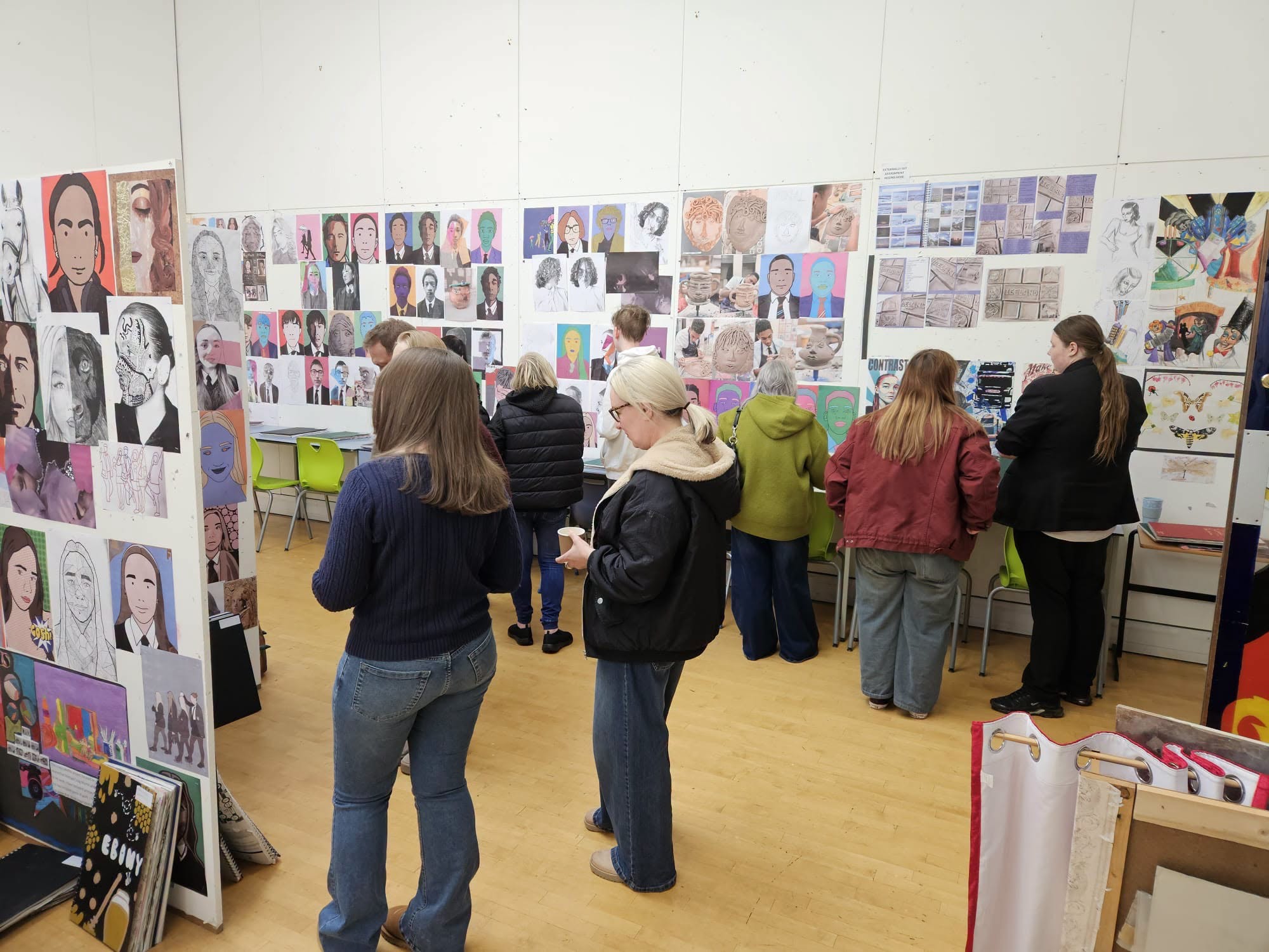 Visitors viewing the works from the talented EMS GCSE art students 