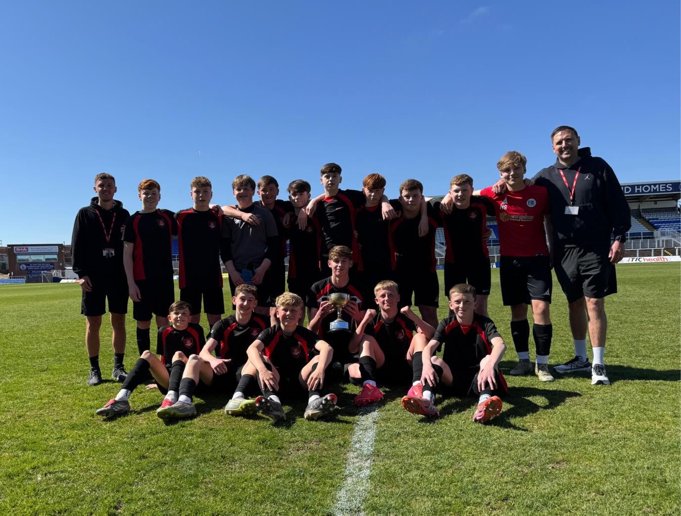 EMS Year 9 football team together after an amazing win