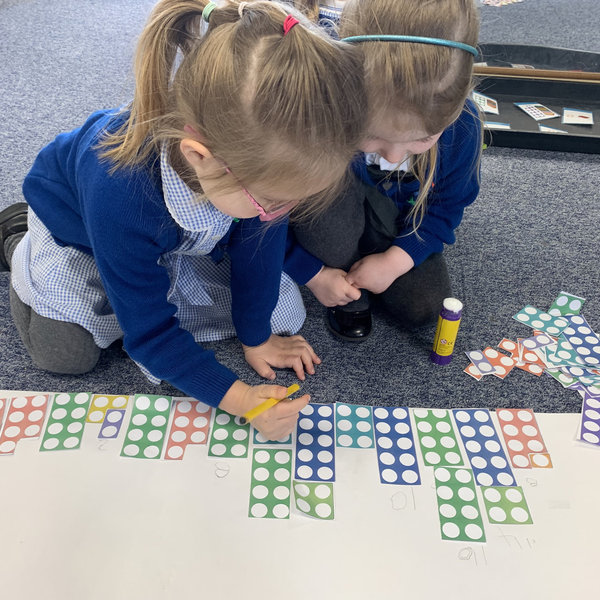 Image of Reception class working hard in Maths!